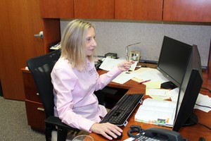 Liz Lottmann at desk