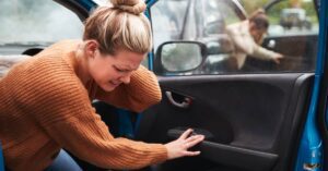 woman holds neck after a car accident | Oliver Law Firm