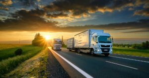 two semi trucks drive on a road | Oliver Law Firm