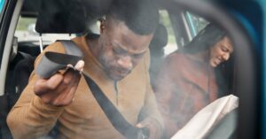 Passenger and driver struggling with injuries after a car accident | Oliver Law Firm